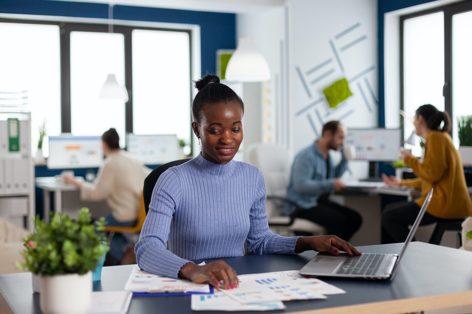 African in marketing corporate office working to finish deadline